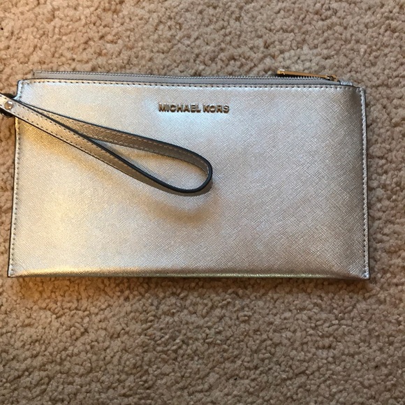 Michael Kors Handbags - Michael Kors Silver Large Clutch